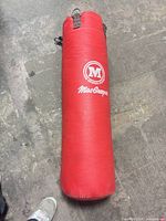 Full view of red MacGregor heavy bag laying flat