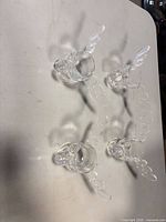 Top view of four clear glass moose shot glasses showing overall set