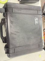 Closed black Pelican hard case top view showing logo and ribs