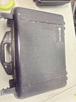 Closed black Stabilotherm hard case top view showing logo plate and handle
