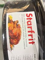 Close-up of Starfrit label on roaster showing brand and product type