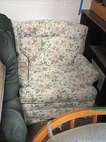 Front view of floral upholstered armchair