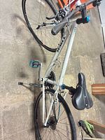 Full side view of white Trek 7.2 FX hybrid bicycle with accessories visible