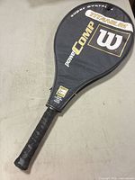 Racket in protective cover on table