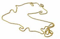Full view of entire gold plated rope chain laid flat