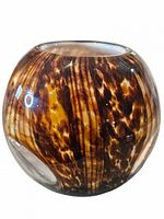 Front view of mottled amber and brown spherical glass vase