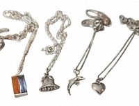 All four chains and pendants laid out