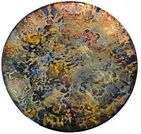 Top view of lacquer plate showing abstract multicolor finish