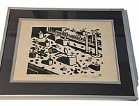 Front view of framed linocut print showing artwork, matting and frame