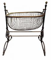 Full view of cast iron and brass swinging cradle