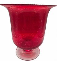 Angled view of entire vase showing flared rim and ruby color