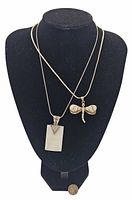 Both necklaces displayed on bust showing overall appearance