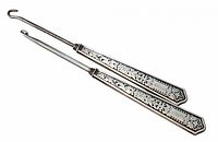 Both sterling button hooks full view showing ornate handles and hooks