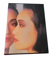Front dust jacket image of facial portrait on one volume