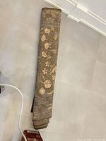 Rug rolled for storage showing edge and pattern