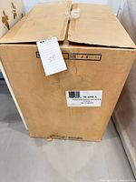 Closed shipping carton showing exterior condition and labeling