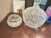 Compote with lid and separate flower frog side by side on table