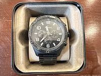 Front view of Fossil chronograph watch in presentation insert