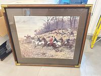 Front view of framed fox hunt print showing artwork, frame, mats and brass corner accents