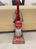 Front view of red Hoover Whole House Elite Pet upright vacuum