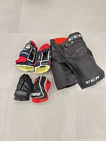 Overview of CCM pants, Warrior gloves, Bauer gloves