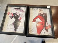Both framed prints side by side on tabletop