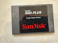 Front view showing SanDisk SSD PLUS branding