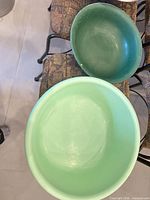 Top view of both plastic bowls showing colors, size, interior condition