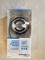 Front view of SpeakerBall S8 Bluetooth speaker sealed in retail box