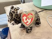 Full view of leopard plush with Ty 2000 heart tag