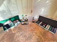 Full lot showing two open chip cases, trophies, card decks and racks