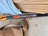Power-Stroke label on pole and folded brown yard bags