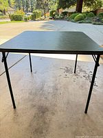 Tabletop view showing green surface and legs extended