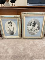 Both framed portrait prints side by side