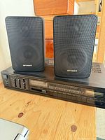 Front view of Realistic STA-130 receiver with both Optimus Pro 77 speakers positioned on top