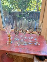 Full set of champagne stems displayed on countertop