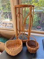 Overall view of umbrella stand and two baskets