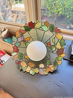 Top view of stained glass shade and frosted globe