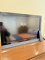 Front view of Vizio 26-inch TV on stand