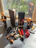 Group shot of all barware, figurines, aerator box and book