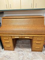 Desk closed showing tambour front and drawer layout