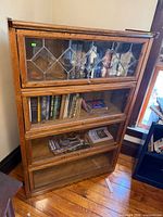 Full view of four-section oak barrister bookcase