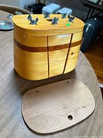 Front view showing wing-nut clamps and wood grain