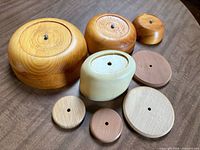 Group view of all wooden basket molds and bases