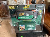 Front of packaged Battery Tender 5A charger showing branding, amperage, and automatic feature