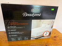 Retail box front showing product image and brand