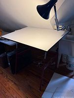 Overall view of drafting table with attached lamp