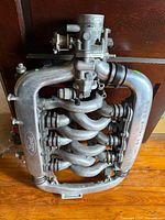 Full intake manifold assembly front view showing runners and throttle body