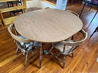 Round wood table with four chairs overview