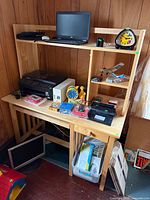 Front view showing desk surface, hutch, pull-out tray and drawer